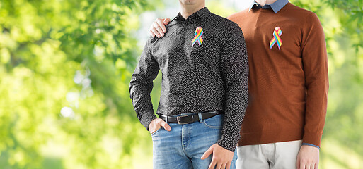 Image showing close up of couple with gay pride rainbow ribbons