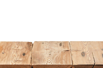 Image showing Rough wooden table on a white background for display and montage your products.