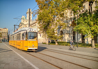 Image showing Yellow tram moving along city road in Budapest, Hungary.