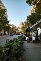 Image showing Town street with sidewalk cafe with view to Hungarian paliament building.