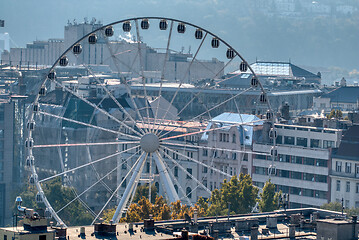 Image showing Budapest Eye, ferris wheel attraction on city background in Budapest.