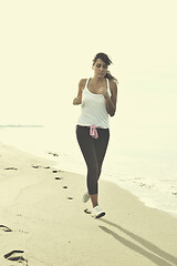 Image showing woman running on beach