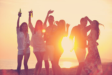 Image showing Group of young people enjoy summer  party at the beach