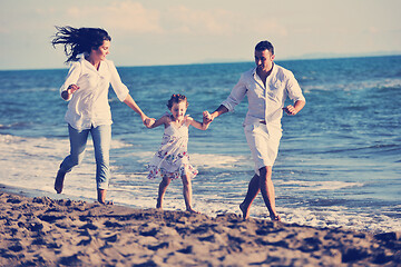 Image showing happy young  family have fun on beach