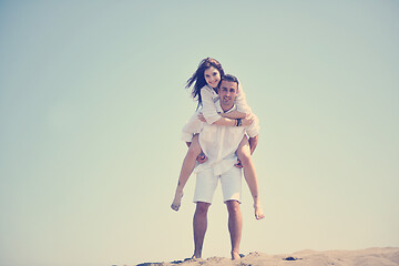 Image showing happy young couple have fun on beach