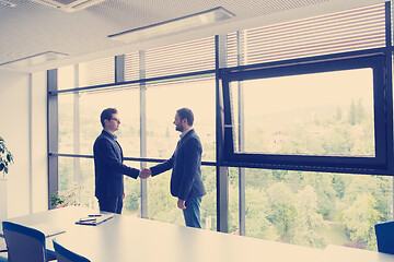 Image showing cloasing the deal in modern office interior