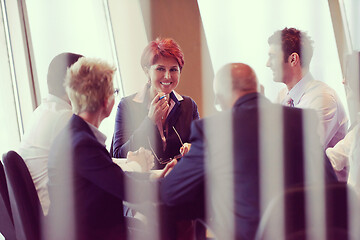 Image showing business people group on meeting at modern bright office