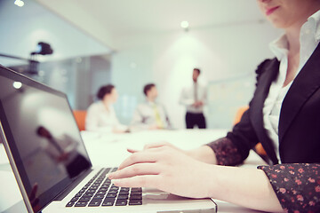 Image showing woman hands typing on laptop keyboard at business meeting