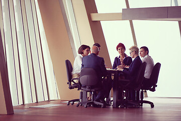 Image showing business people group on meeting at modern bright office