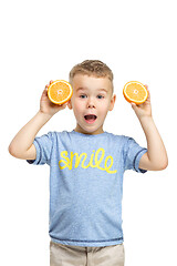 Image showing Full length portrait of cute little kid in stylish clothes with orange