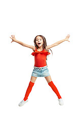 Image showing Cute little girl jump. Studio shot. White background