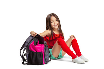 Image showing Full length portrait of cute little kid in stylish jeans clothes looking at camera and smiling