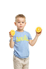 Image showing Full length portrait of cute little kid in stylish clothes with orange