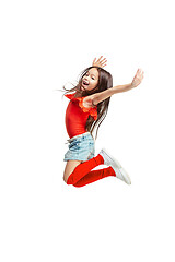 Image showing Cute little girl jump. Studio shot. White background