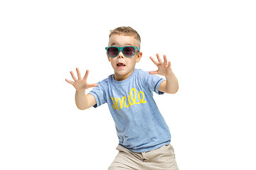 Image showing Full length portrait of cute little kid in stylish clothes looking at camera and smiling