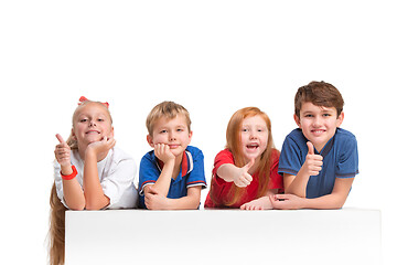 Image showing Full length portrait of cute little kids in stylish clothes looking at camera and smiling