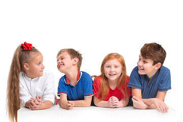 Image showing Full length portrait of cute little kids in stylish clothes looking at camera and smiling