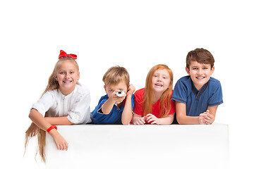 Image showing Full length portrait of cute little kids in stylish clothes looking at camera and smiling