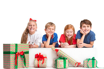 Image showing Full length portrait of cute little kids in stylish clothes looking at camera and smiling