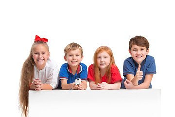 Image showing Full length portrait of cute little kids in stylish clothes looking at camera and smiling