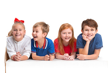 Image showing Full length portrait of cute little kids in stylish clothes looking at camera and smiling