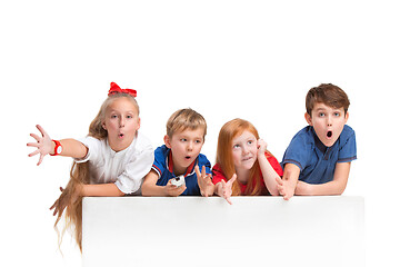 Image showing Full length portrait of cute little kids in stylish clothes looking at camera and smiling