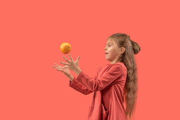 Image showing Cute little girl in coral dress with long hair