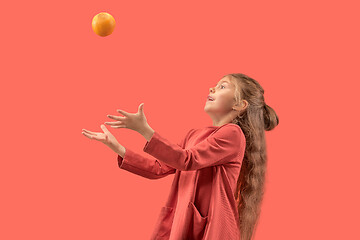 Image showing Cute little girl in coral dress with long hair