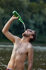 Image showing Man drinking like crazy