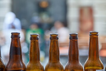 Image showing Beer bottles at a pub terrace