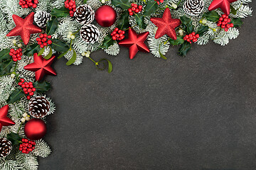 Image showing Christmas Border with Red Star Baubles and Winter Greenery