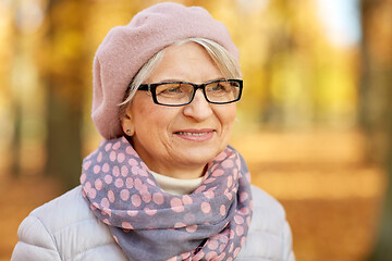 Image showing portrait of happy senior woman at autumn park