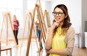 Image showing happy asian woman in glasses or student