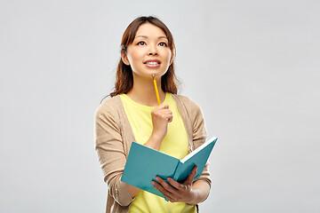 Image showing asian student woman with diary and pencil