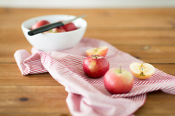 Image showing apples and kitchen knife on towel