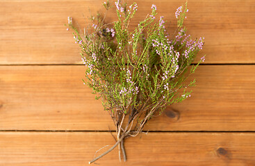 Image showing heather bush on wooden table