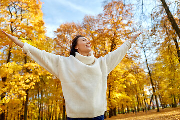 Image showing beautiful happy young woman in autumn park