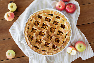 Image showing apple pie in baking mold on wooden table