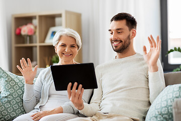 Image showing old mother and adult son with tablet pc at home