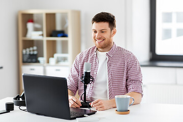 Image showing blogger with laptop and microphone audio blogging