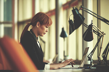 Image showing business woman working on computer at office