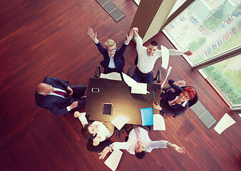 Image showing top view of business people group throwing dociments in air