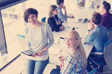 Image showing Pretty Businesswomen Using Tablet In Office Building during conf