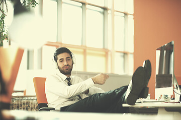 Image showing relaxed young business man at office