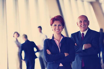 Image showing diverse business people group with redhair  woman in front