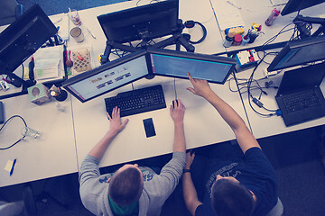 Image showing young programmers writing programming code top view