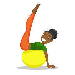 Image showing African-american woman exercising with fit ball.