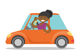 Image showing African-american woman showing key to her new car.