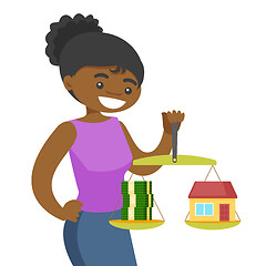 Image showing Young woman holding scales with money and house.