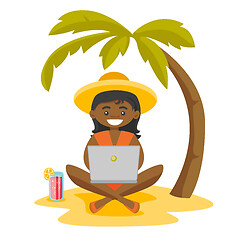 Image showing Business woman working on a laptop on the beach.